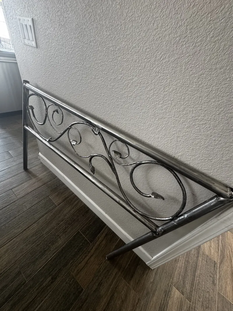 Custom ornamental iron railing with scrollwork, fabricated and installed by Mobile Welding Unlimited