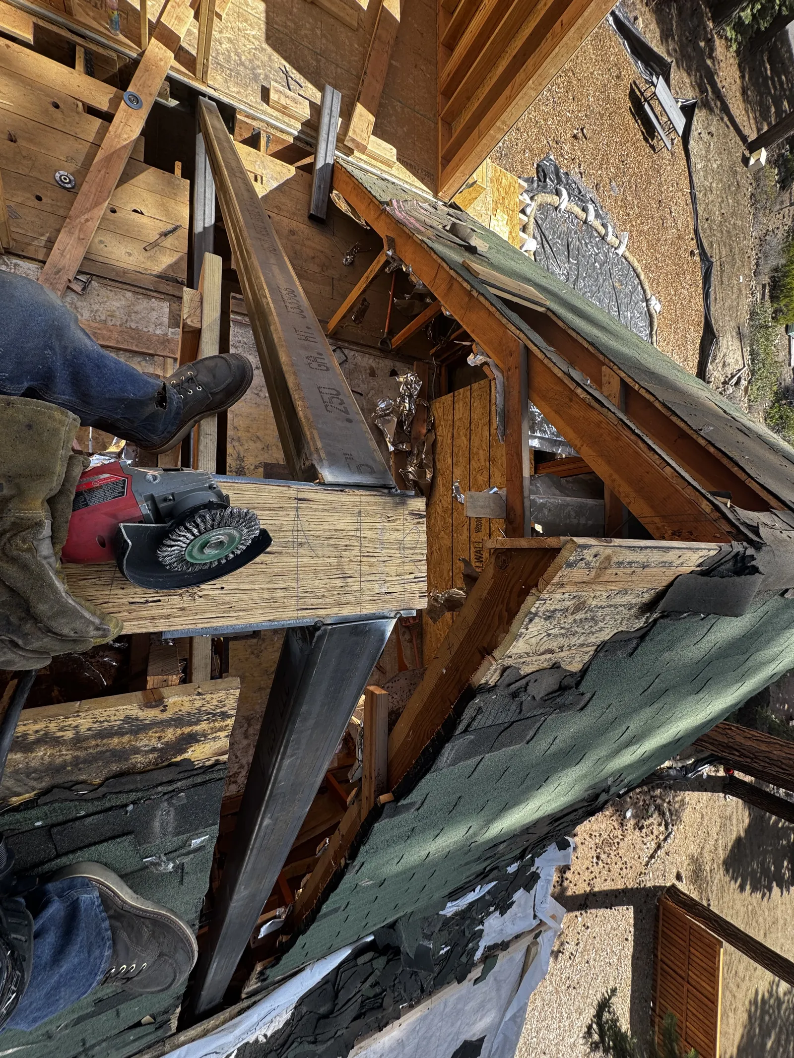 Trevor reinforcing roof framing on a structural job site in Reno, Nevada